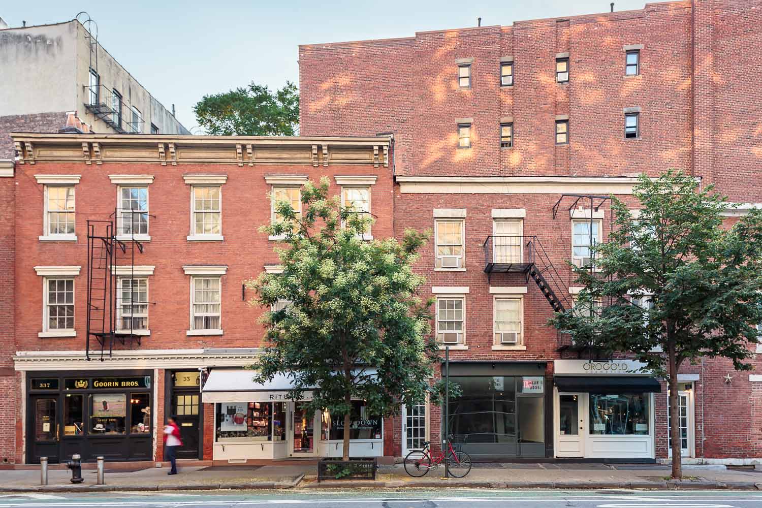 Stretch of four historic commercial storefronts on the corner of Bleecker and Christopher Streets in the West Village