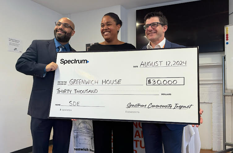 Greenwich House staff recieving check